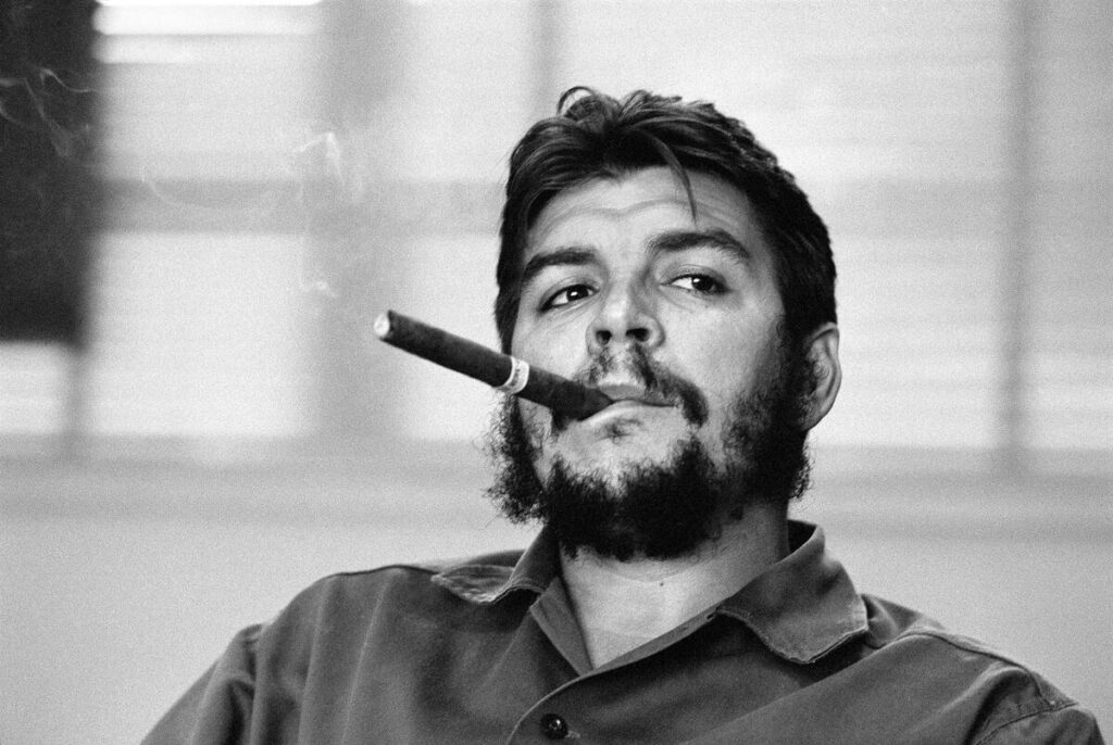 Ernesto Guevara (Che), Argentinian politician, Minister of Industry for Cuba (1961-1965) during an exclusive interview in his office. Ministry of Industry. Havana, Cuba. 1963. © René Burri / Magnum
